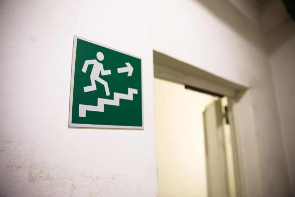 Emergency exit sign in building